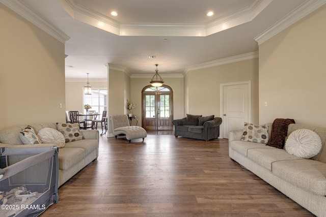 742 Hummingbird Ln, New Iberia, LA 70563 - living area with a tray ceiling, wood finished floors, ornamental molding, and french doors