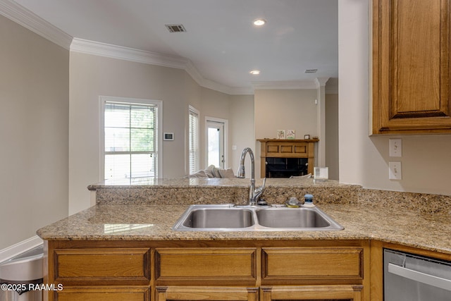 742 Hummingbird Ln, New Iberia, LA 70563 - kitchen with stainless steel dishwasher, brown cabinetry, crown molding, open floor plan, and recessed lighting