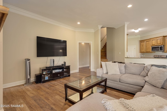 742 Hummingbird Ln, New Iberia, LA 70563 - living room with stairs, wood finished floors, recessed lighting, and crown molding