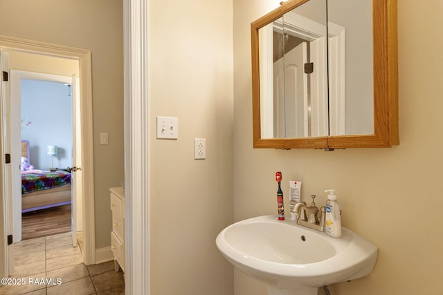 742 Hummingbird Ln, New Iberia, LA 70563 - bathroom with a sink and tile patterned flooring