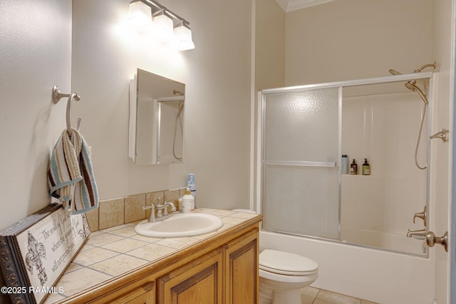 742 Hummingbird Ln, New Iberia, LA 70563 - full bathroom with vanity, bath / shower combo with glass door, tile patterned flooring, and crown molding