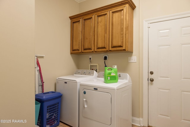 742 Hummingbird Ln, New Iberia, LA 70563 - washroom featuring washing machine and clothes dryer and cabinet space