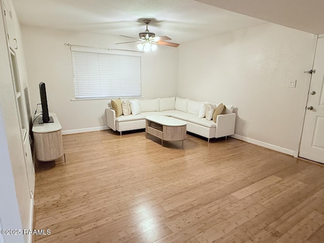 3121 Johnston St Unit 207, Lafayette, LA 70503 - living room featuring light wood finished floors and a ceiling fan