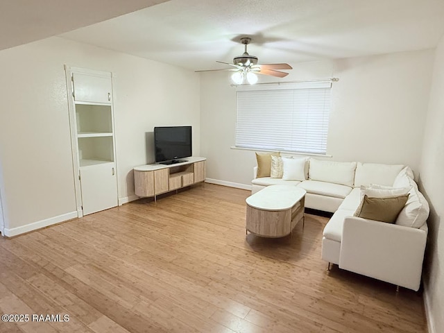 3121 Johnston St Unit 207, Lafayette, LA 70503 - living area with a ceiling fan and light wood-type flooring