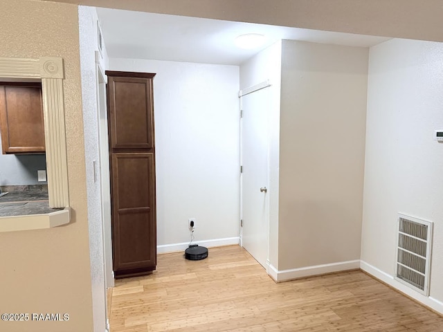 3121 Johnston St Unit 207, Lafayette, LA 70503 - laundry room with light wood-style floors and heating unit