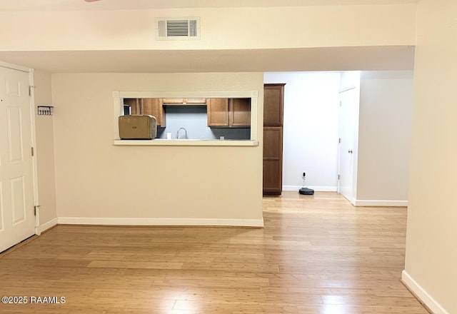 3121 Johnston St Unit 207, Lafayette, LA 70503 - unfurnished room with light wood-style flooring and baseboards