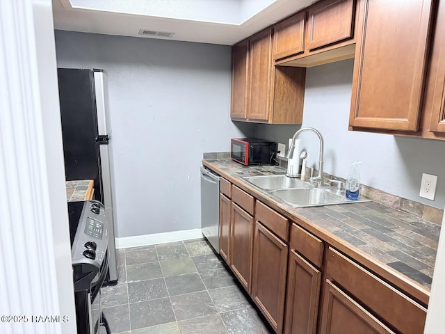 3121 Johnston St Unit 207, Lafayette, LA 70503 - kitchen with tile counters, dishwasher, brown cabinets, and dark stone finish flooring