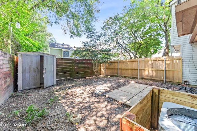 313 Sidney Martin Rd, Lafayette, LA 70507 - fenced backyard with a storage shed and a patio
