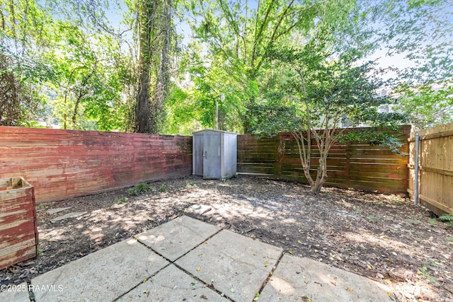 313 Sidney Martin Rd, Lafayette, LA 70507 - fenced backyard with a patio area and a shed