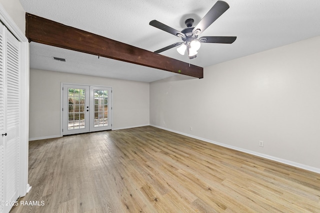 313 Sidney Martin Rd, Lafayette, LA 70507 - unfurnished room featuring ceiling fan, wood finished floors, beam ceiling, and french doors