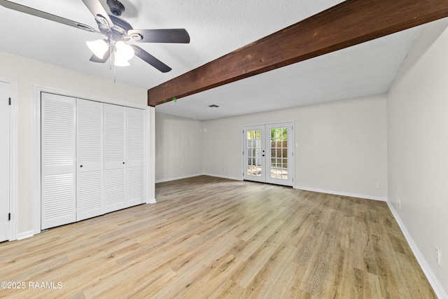 313 Sidney Martin Rd, Lafayette, LA 70507 - unfurnished bedroom featuring light wood-style floors, beam ceiling, a ceiling fan, a closet, and access to exterior
