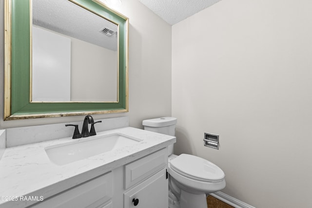 313 Sidney Martin Rd, Lafayette, LA 70507 - bathroom featuring a textured ceiling and vanity