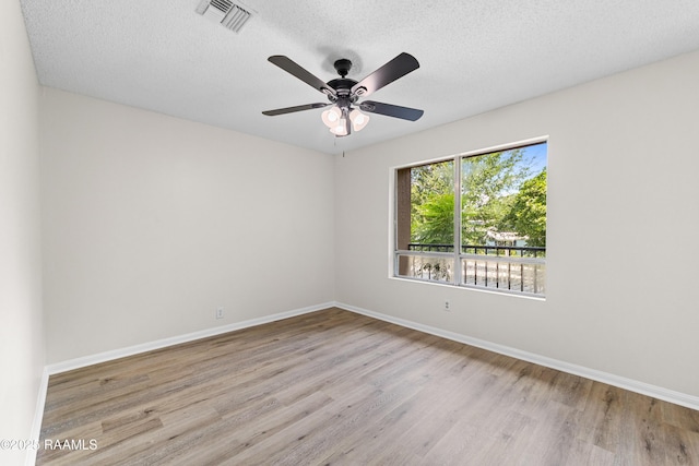 313 Sidney Martin Rd, Lafayette, LA 70507 - empty room with wood finished floors, ceiling fan, and a textured ceiling