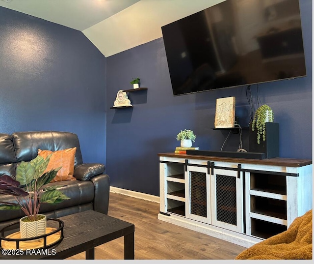 205 Acadian Lake Dr, Duson, LA 70529 - living area with wood finished floors and vaulted ceiling