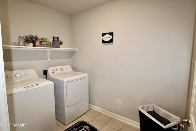 205 Acadian Lake Dr, Duson, LA 70529 - laundry room featuring washer and dryer and light tile patterned floors