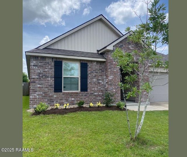205 Acadian Lake Dr, Duson, LA 70529 - ranch-style home with a garage, brick siding, a front yard, board and batten siding, and driveway
