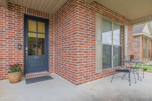 201 Spanish Moss Ln, Broussard, LA 70518 - view of exterior entry featuring brick siding and covered porch