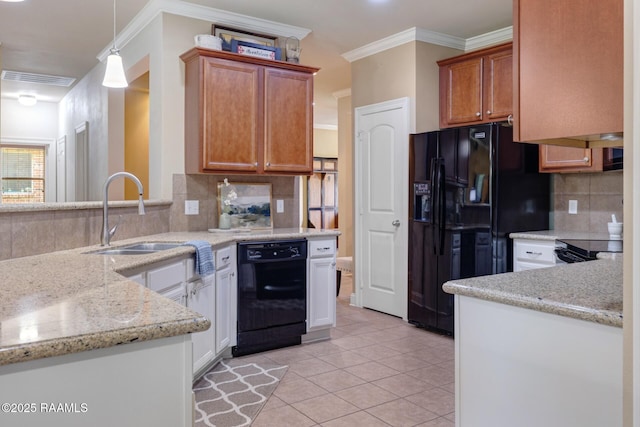 201 Spanish Moss Ln, Broussard, LA 70518 - kitchen with black appliances, backsplash, ornamental molding, light tile patterned flooring, and light stone countertops