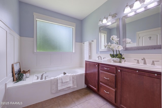 201 Spanish Moss Ln, Broussard, LA 70518 - bathroom featuring double vanity, a bath, and tile patterned floors