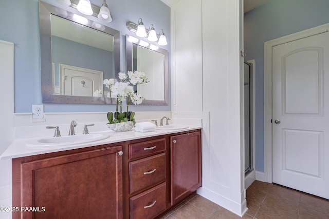 201 Spanish Moss Ln, Broussard, LA 70518 - bathroom with double vanity, tile patterned floors, and a shower with shower door