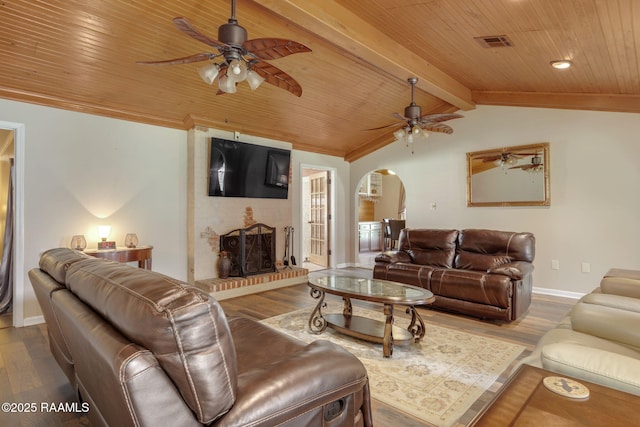122 Thrush Loop, Lafayette, LA 70508 - living area with a ceiling fan, arched walkways, wooden ceiling, wood finished floors, and a fireplace