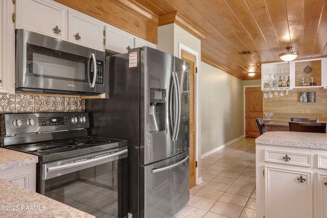 122 Thrush Loop, Lafayette, LA 70508 - kitchen featuring appliances with stainless steel finishes, crown molding, light tile patterned flooring, white cabinets, and light countertops