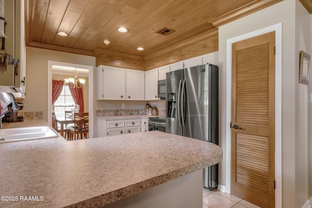 122 Thrush Loop, Lafayette, LA 70508 - kitchen with a chandelier, wood ceiling, a peninsula, stainless steel refrigerator with ice dispenser, and light countertops