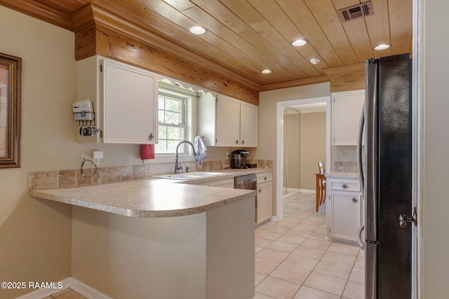 122 Thrush Loop, Lafayette, LA 70508 - kitchen with stainless steel appliances, a peninsula, recessed lighting, white cabinetry, and light countertops