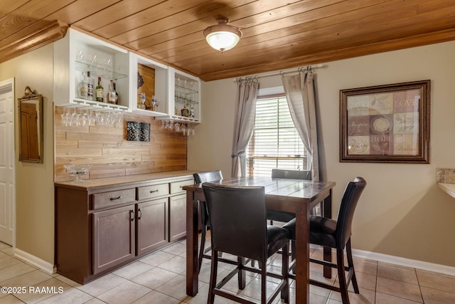 122 Thrush Loop, Lafayette, LA 70508 - dining area with wood ceiling, a bar, and light tile patterned flooring