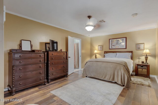 122 Thrush Loop, Lafayette, LA 70508 - bedroom with light wood-type flooring and crown molding