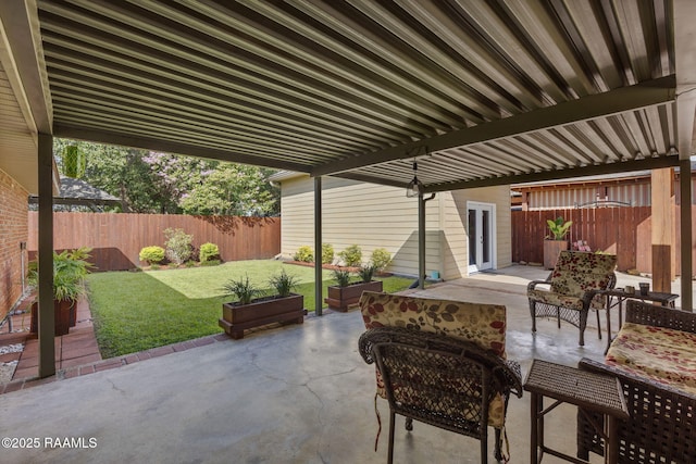 122 Thrush Loop, Lafayette, LA 70508 - fenced backyard featuring a patio and outdoor lounge area
