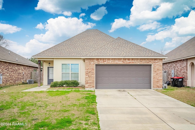 117 Gray Birch Loop, Youngsville, LA 70592 - view of front of house with concrete driveway, roof with shingles, a garage, a front yard, and brick siding