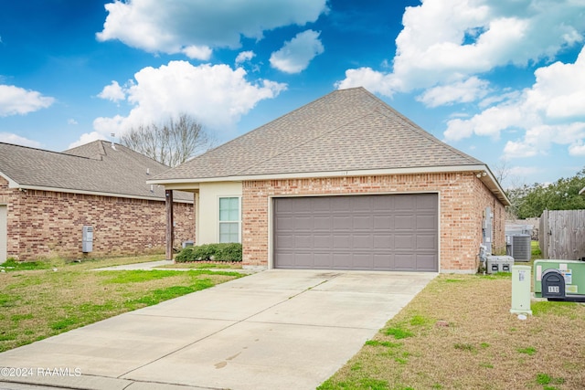 117 Gray Birch Loop, Youngsville, LA 70592 - view of front of property with concrete driveway, brick siding, a garage, and a shingled roof