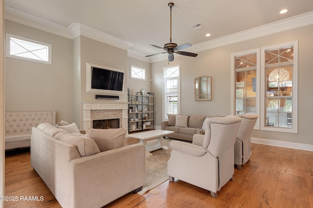 301 Gleneagles Cir, Broussard, LA 70518 - living room with a fireplace, healthy amount of natural light, a ceiling fan, light wood-style flooring, and recessed lighting