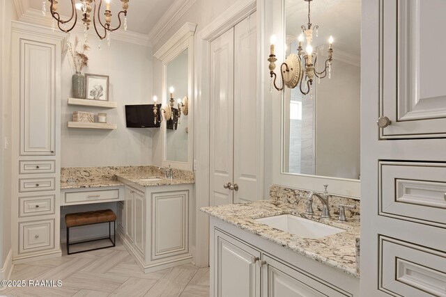 301 Gleneagles Cir, Broussard, LA 70518 - full bath featuring a chandelier, two vanities, and ornamental molding