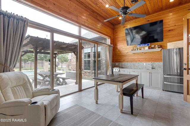 301 Gleneagles Cir, Broussard, LA 70518 - dining area with wood ceiling, a ceiling fan, recessed lighting, light tile patterned floors, and wood walls