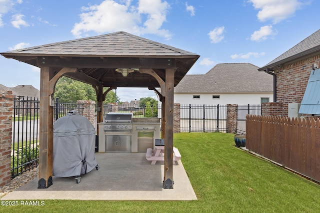 301 Gleneagles Cir, Broussard, LA 70518 - fenced backyard featuring an outdoor kitchen, a gazebo, and a patio area