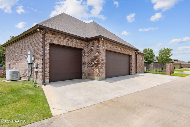 301 Gleneagles Cir, Broussard, LA 70518 - view of side of property with brick siding, concrete driveway, a garage, and a shingled roof