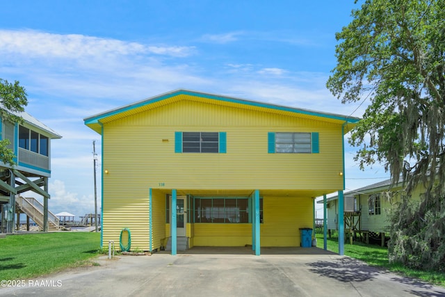116 Sunset Blvd, Cypremort Point, LA 70538 - view of front of home featuring concrete driveway, a front lawn, and stairs