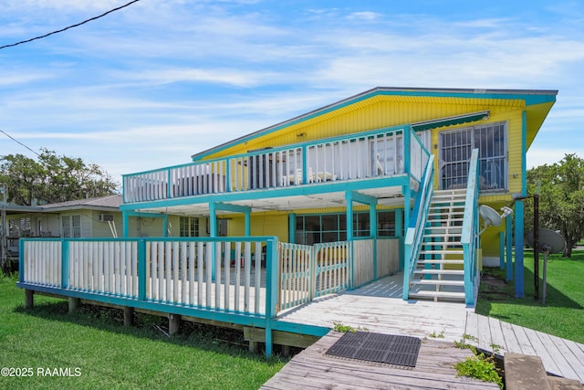 116 Sunset Blvd, Cypremort Point, LA 70538 - rear view of house with a wooden deck, a lawn, and stairs