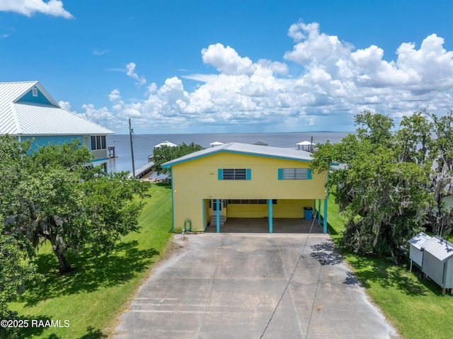 116 Sunset Blvd, Cypremort Point, LA 70538 - view of front of home with driveway, a front yard, and a water view