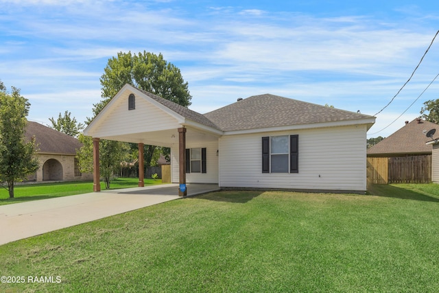 1404 Howard St, New Iberia, LA 70563 - view of front facade with driveway, an attached carport, and roof with shingles