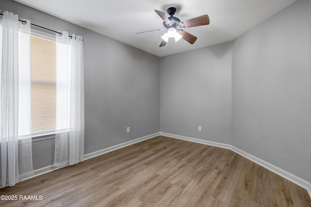 1404 Howard St, New Iberia, LA 70563 - empty room with wood finished floors and a ceiling fan