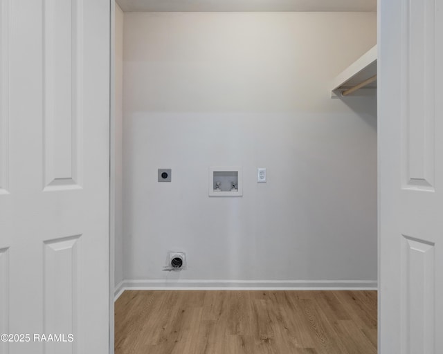 1404 Howard St, New Iberia, LA 70563 - laundry area with hookup for a washing machine, hookup for an electric dryer, and light wood-style flooring