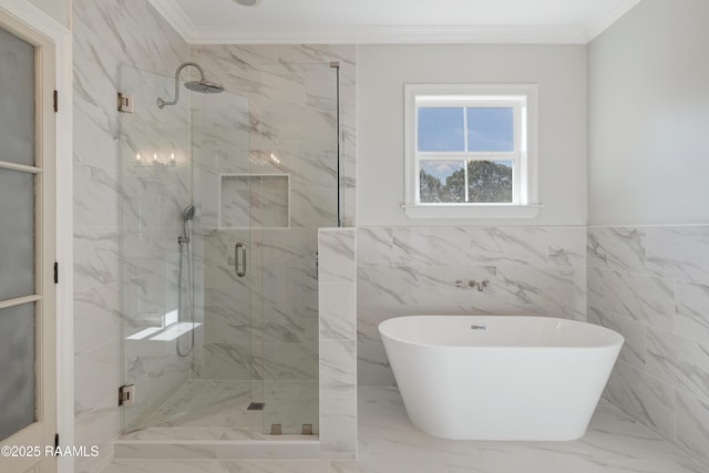 12511 Aube Dr, Abbeville, LA 70510 - full bathroom featuring a freestanding tub, ornamental molding, a marble finish shower, marble finish flooring, and wainscoting