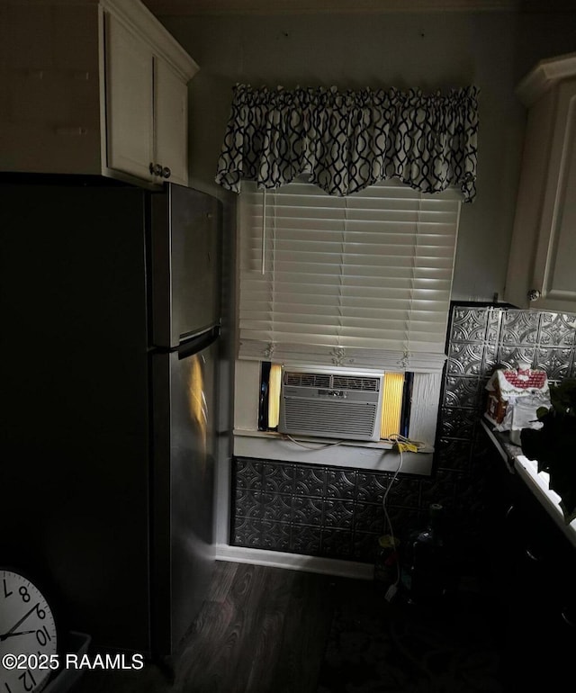 623 Malain St, New Iberia, LA 70560 - kitchen featuring freestanding refrigerator, dark wood-style flooring, and white cabinets
