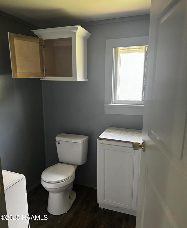 625 Malain St, New Iberia, LA 70560 - half bathroom featuring toilet and wood finished floors
