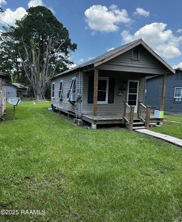 625 Malain St, New Iberia, LA 70560 - shotgun-style home with a front yard and a porch