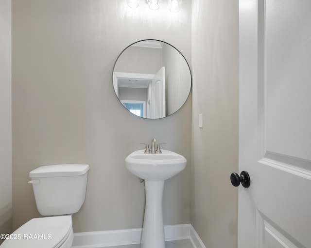 11511 Baker Senior Dr, Abbeville, LA 70510 - bathroom with toilet and baseboards
