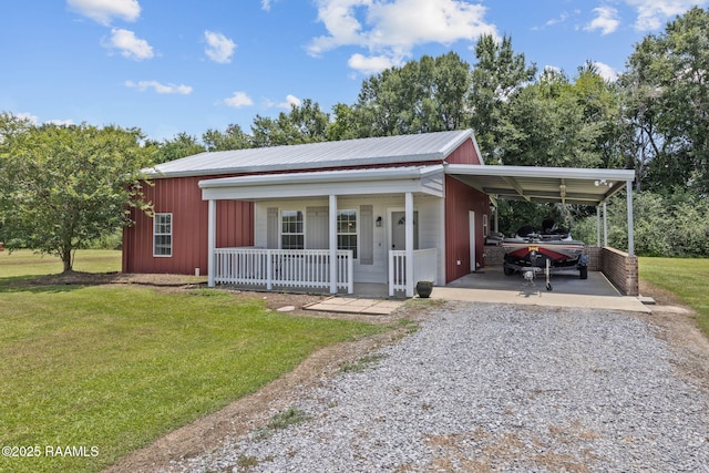 7804 Picard Rd, Maurice, LA 70555 - single story home featuring a porch, gravel driveway, a front yard, and a carport